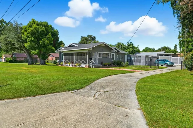 a bedroom with a large bed and a flat screen tv