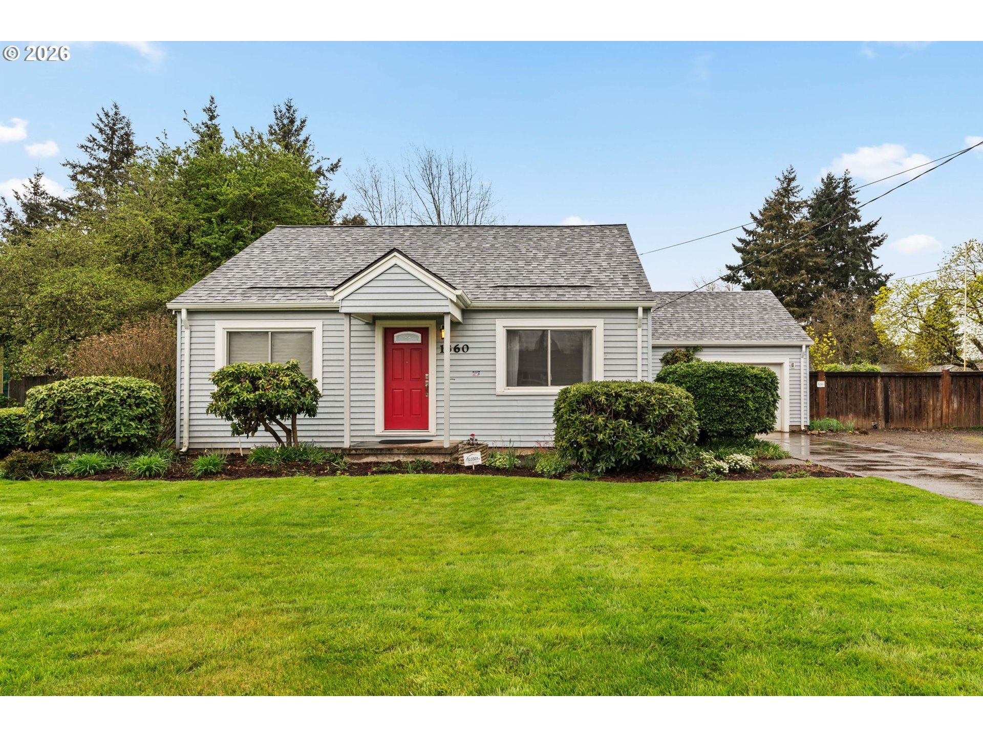 1360 Taft Street Eugene, OR 97402 - Photo 2 of 35 a front view of a house with a yard