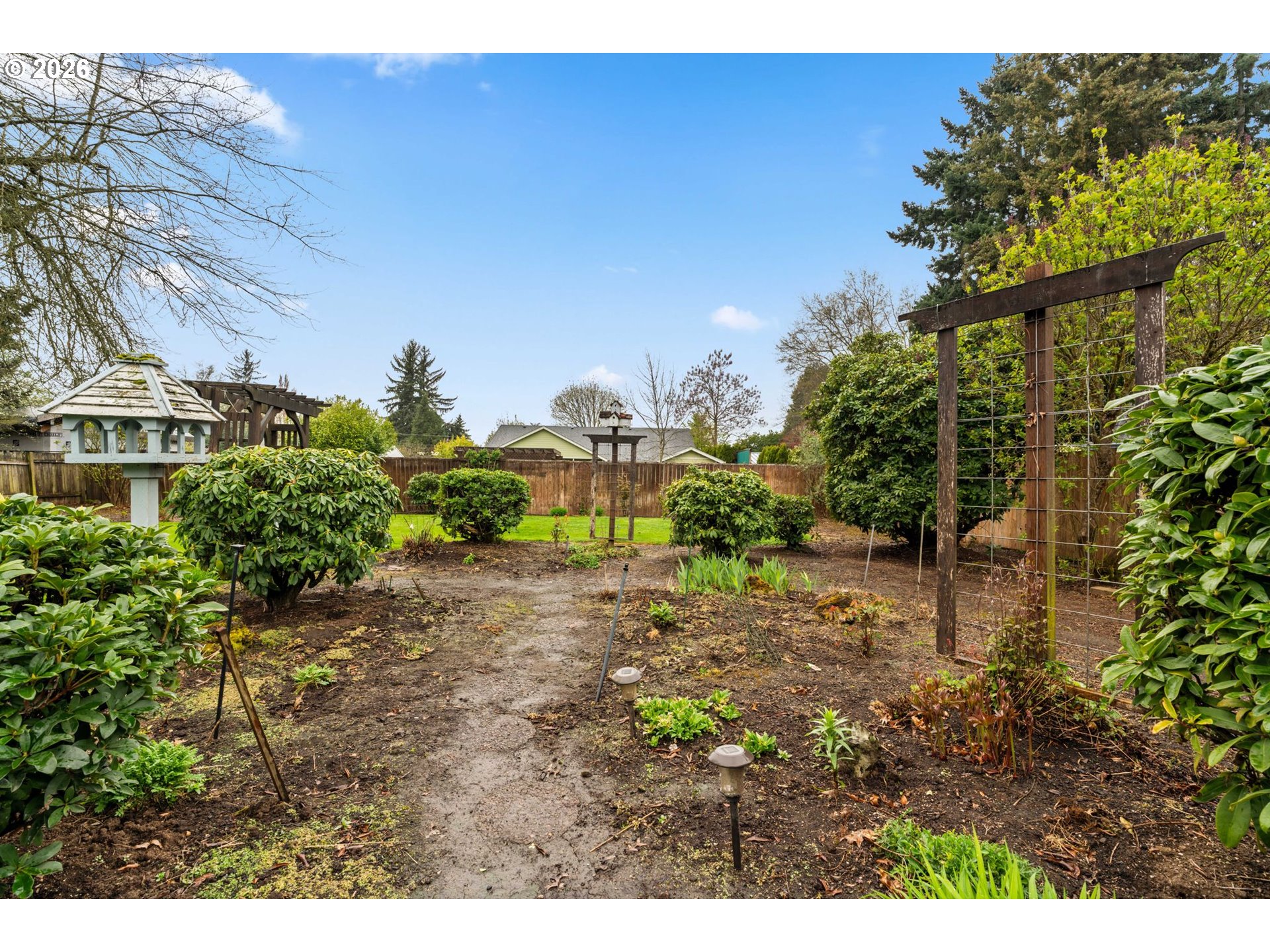 1360 Taft Street Eugene, OR 97402 - Photo 25 of 35 a view of a yard with plants and a fountain