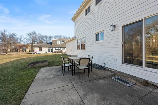 a view of a backyard with sitting area