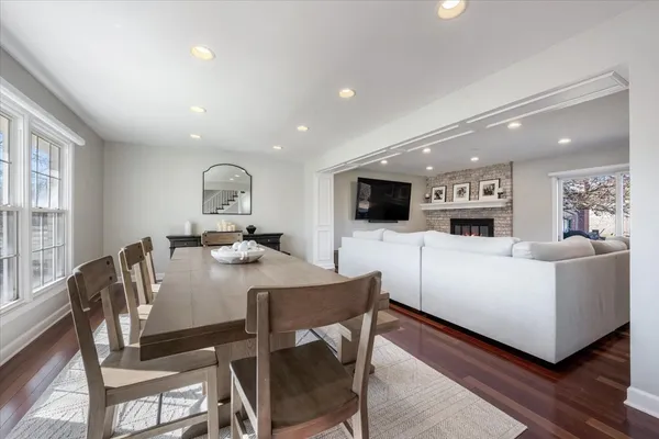 a view of a dining room with furniture and a flat screen tv