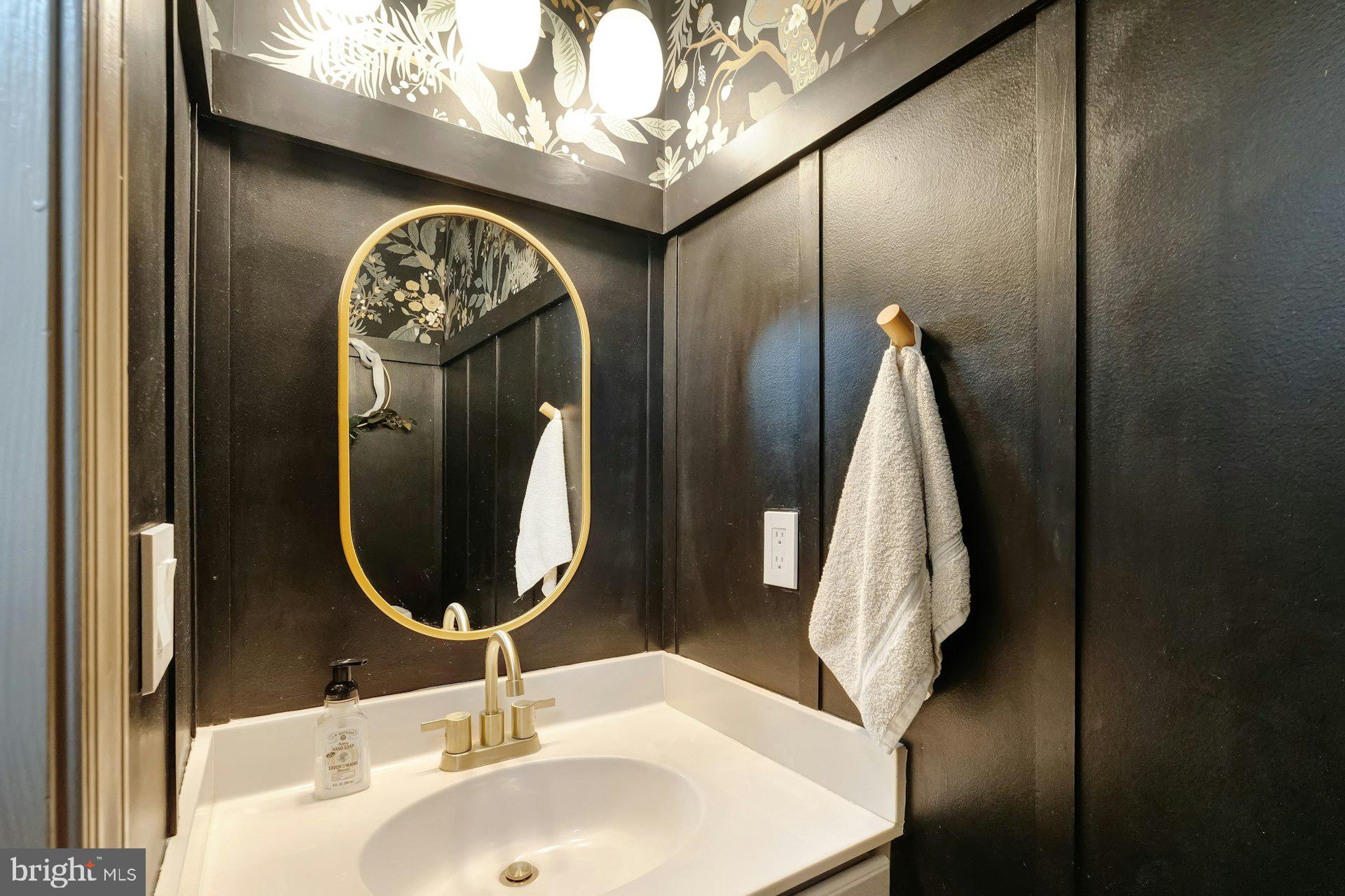 43602 Blacksmith Square Ashburn, VA 20147 - Photo 12 of 33 a bathroom with a sink and a mirror