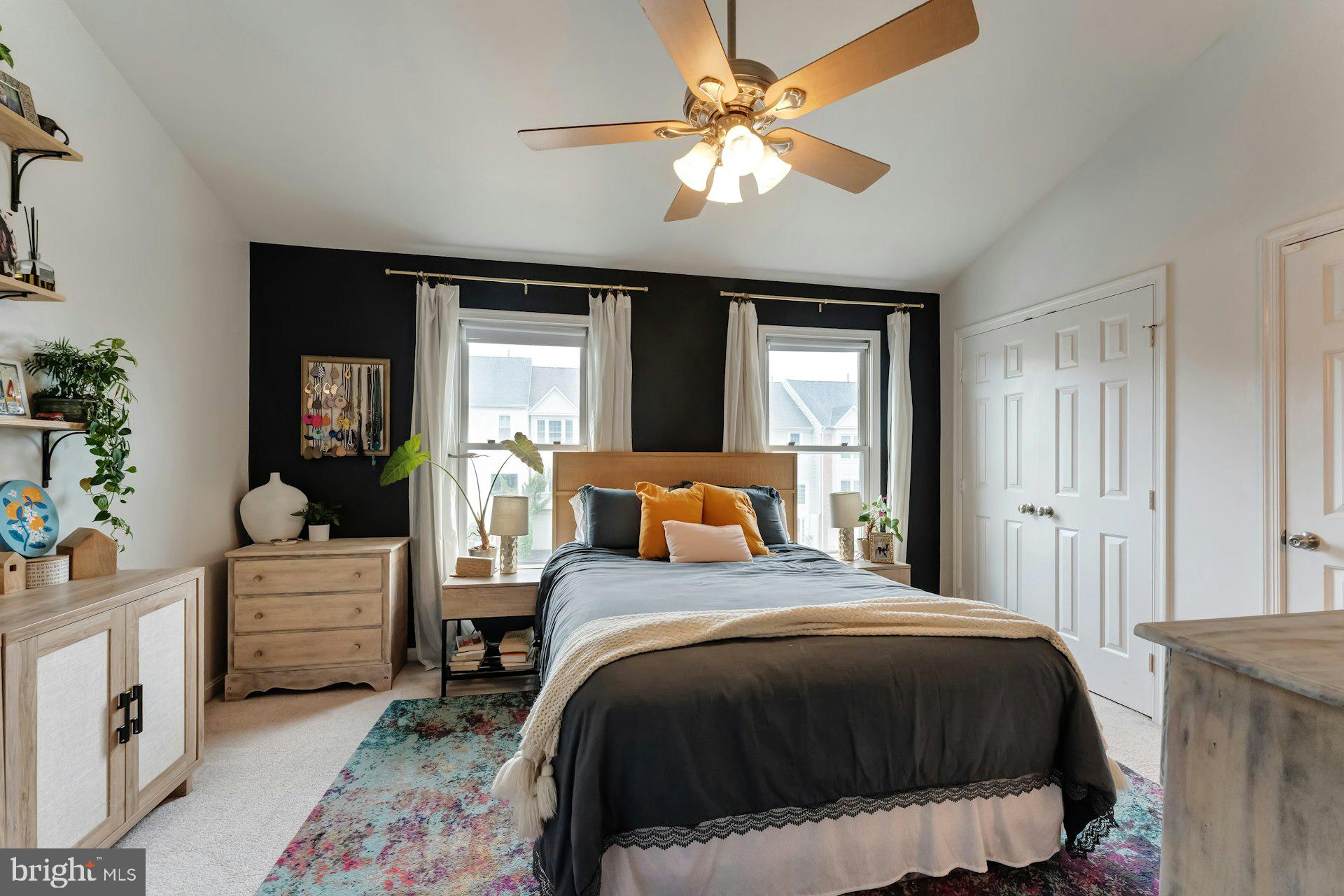 43602 Blacksmith Square Ashburn, VA 20147 - Photo 15 of 33 a bedroom with a large bed and a chandelier