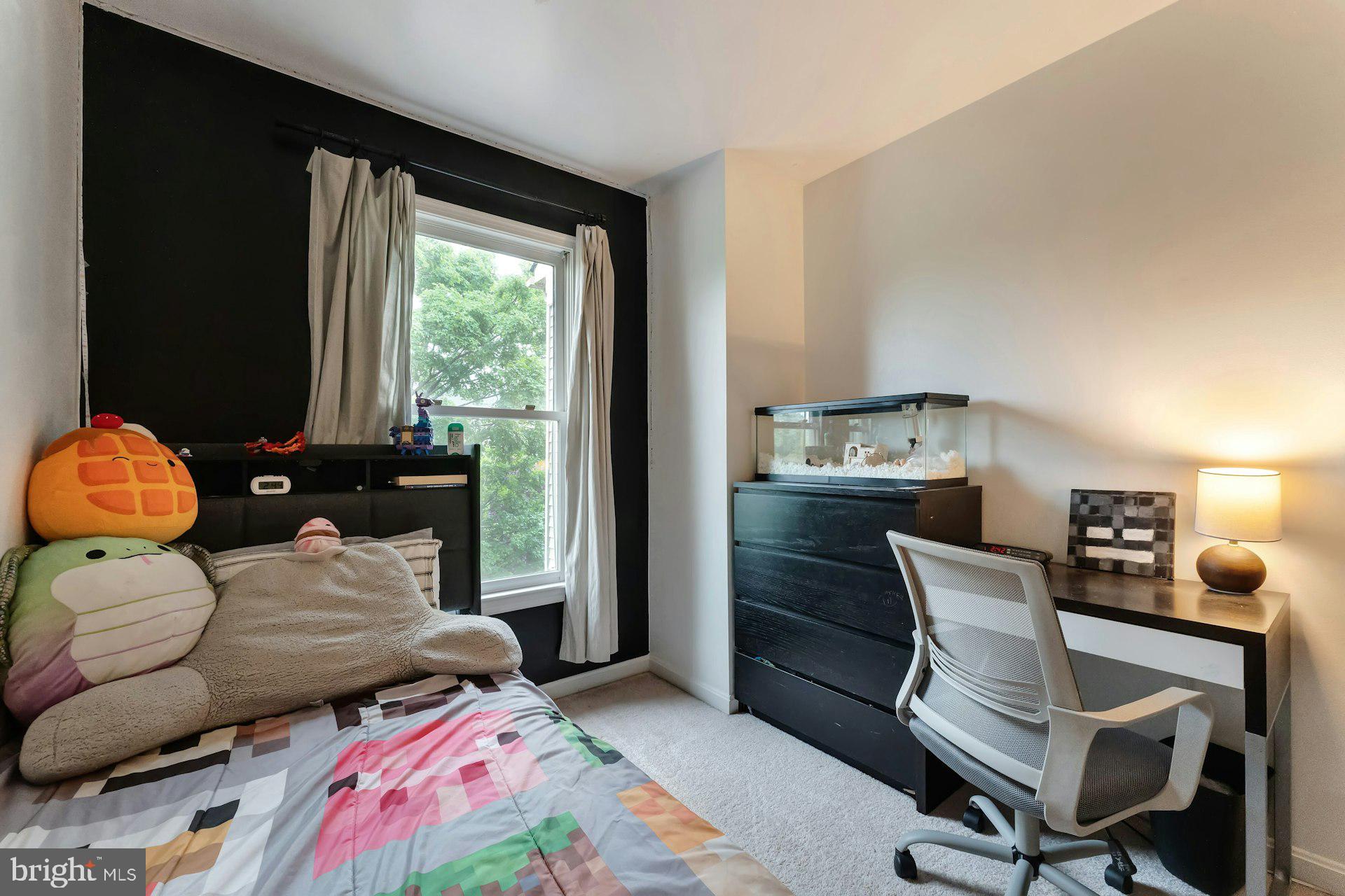 43602 Blacksmith Square Ashburn, VA 20147 - Photo 21 of 33 a bedroom with furniture and a window