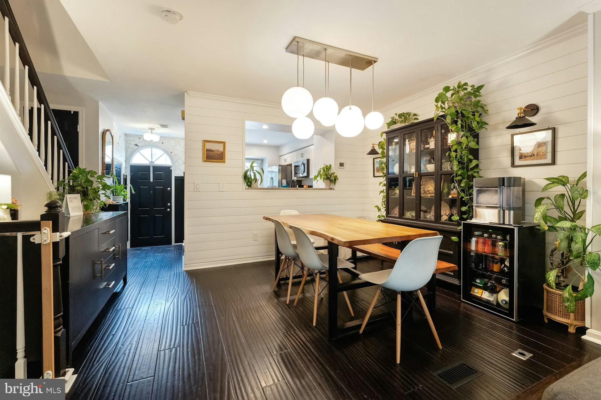 43602 Blacksmith Square Ashburn, VA 20147 - Photo 7 of 33 a view of a dining room with furniture and wooden floor