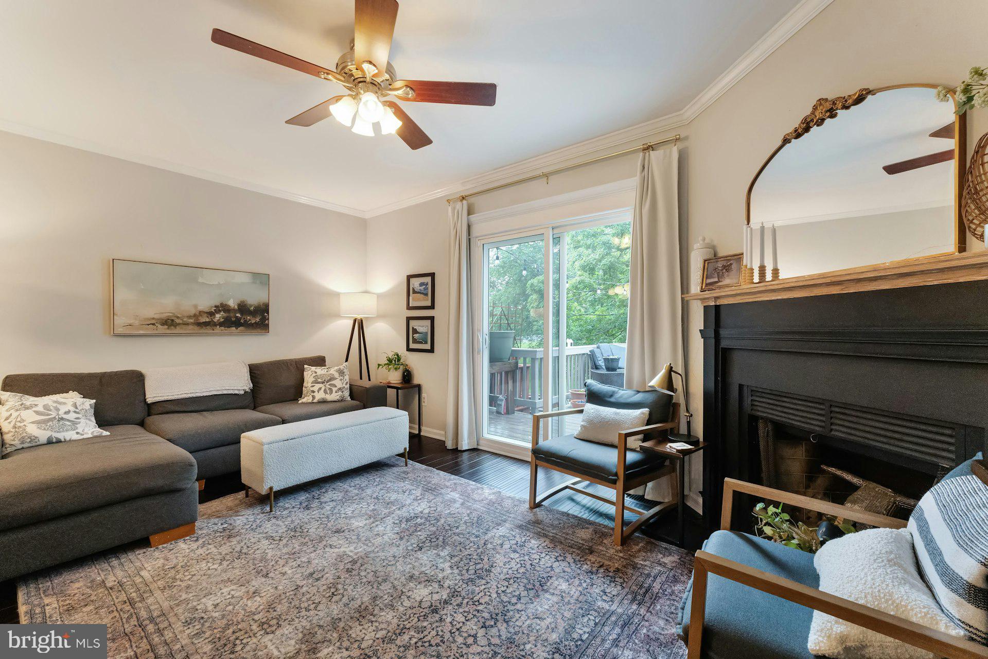 43602 Blacksmith Square Ashburn, VA 20147 - Photo 10 of 33 a living room with furniture and a fireplace
