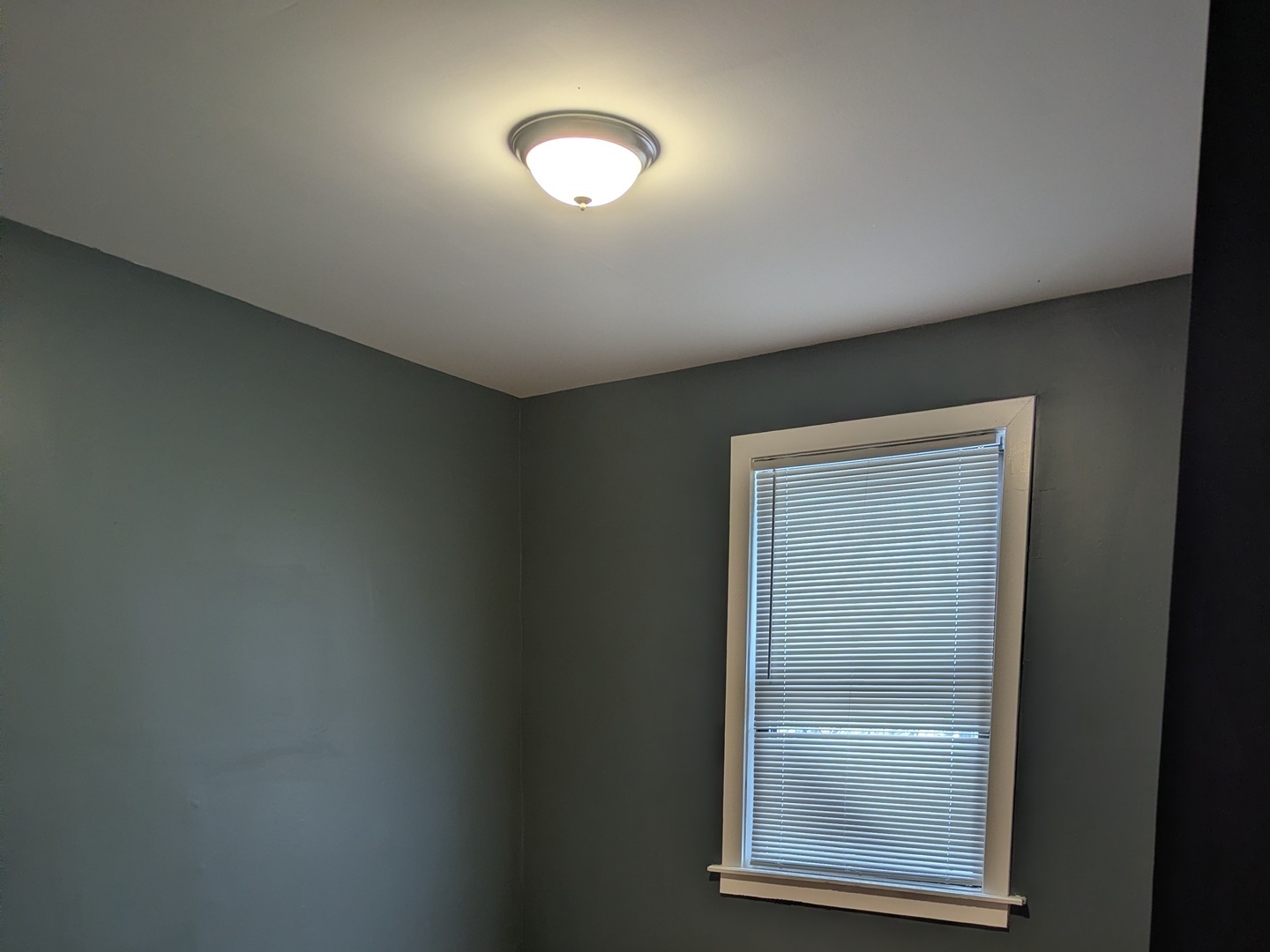 11005 South Perry Avenue, Unit 2 Chicago, IL 60628 - Photo 8 of 17 a view of an empty room with a window