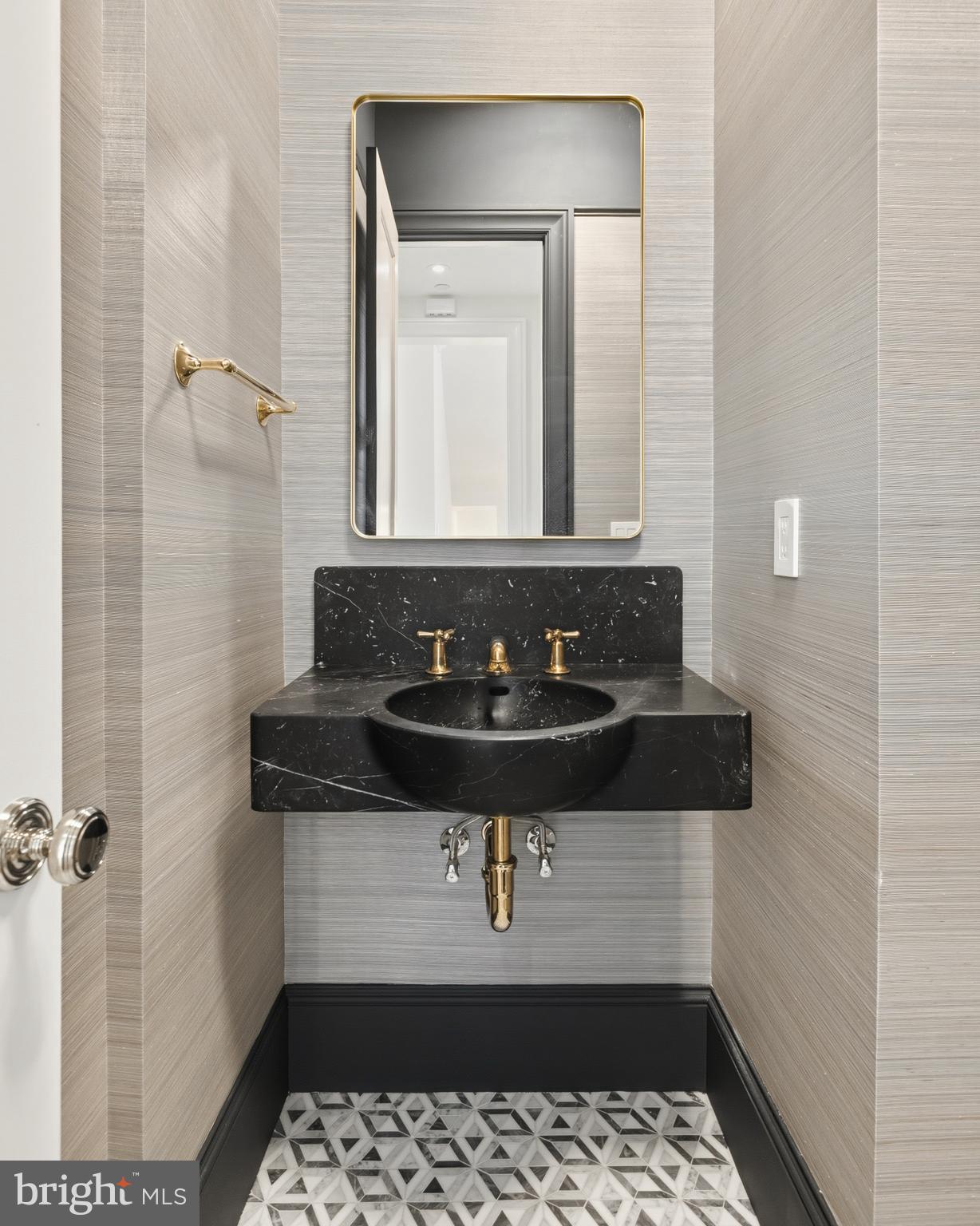 2604 36th Street Northwest Washington, DC 20007 - Photo 11 of 38 a bathroom with a sink a mirror and a shower