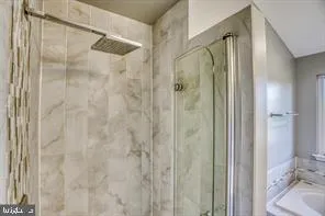 a bathroom with a shower and toilet