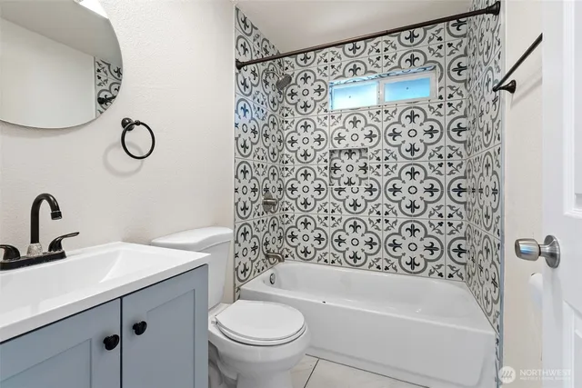 a bathroom with a sink a toilet and a bathtub