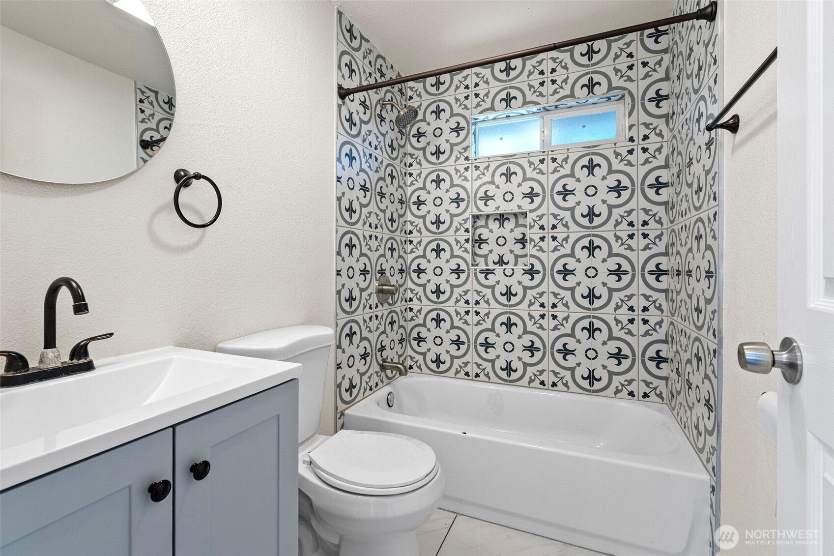 8502-8508 Berkeley Avenue Southwest Lakewood, WA 98498 - Photo 12 of 19 a bathroom with a sink a toilet and a bathtub