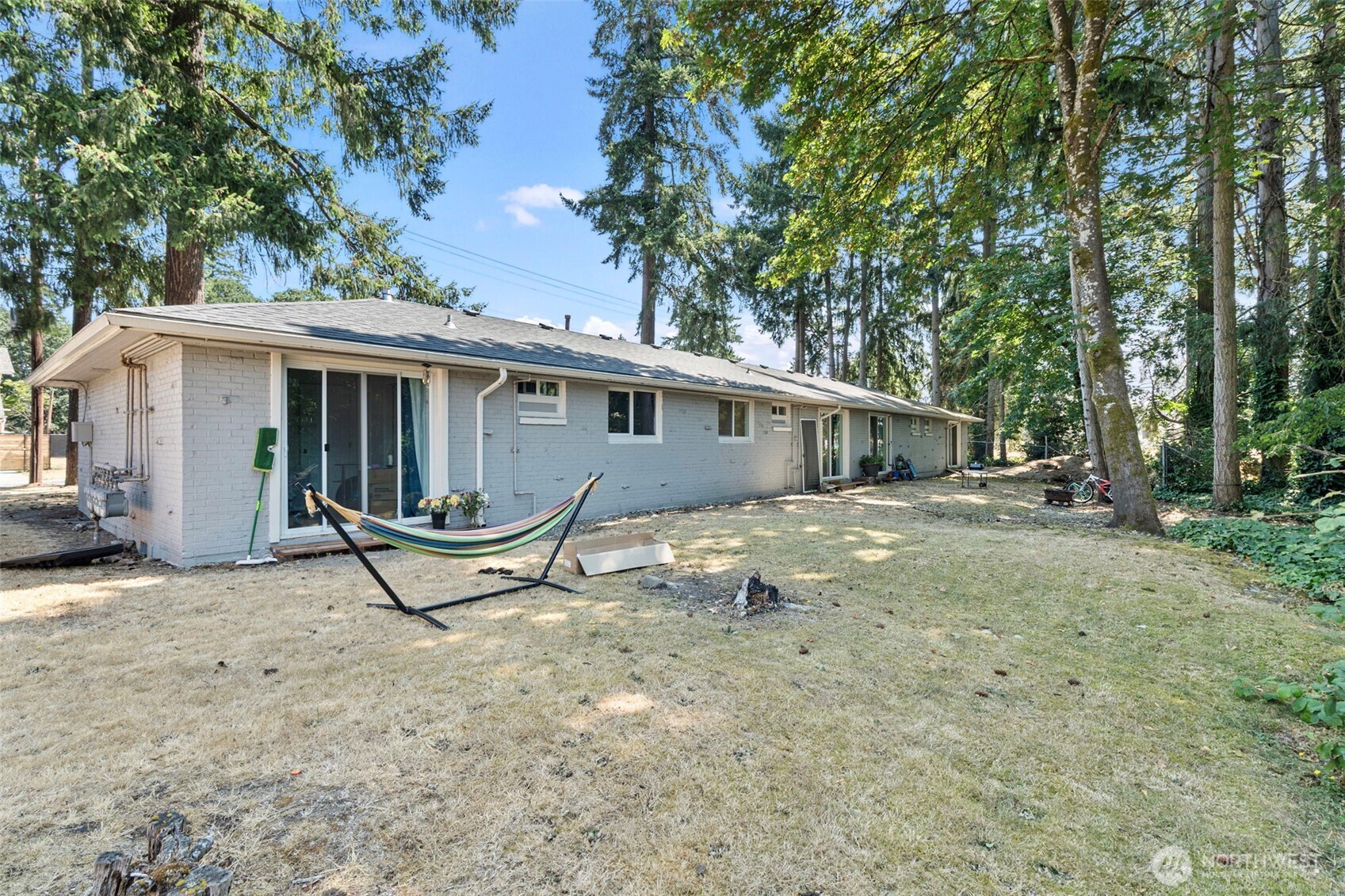 8502-8508 Berkeley Avenue Southwest Lakewood, WA 98498 - Photo 15 of 19 a view of a house with backyard and sitting area
