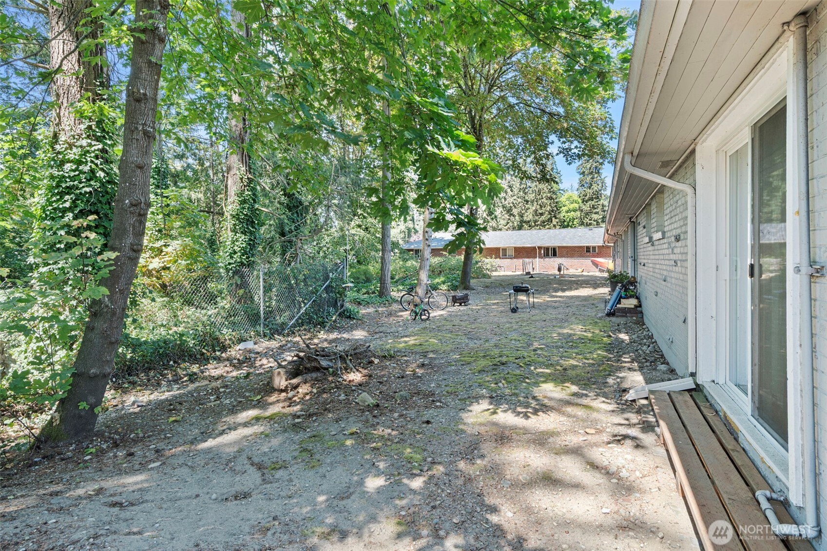 8502-8508 Berkeley Avenue Southwest Lakewood, WA 98498 - Photo 17 of 19 a view of a yard with a tree