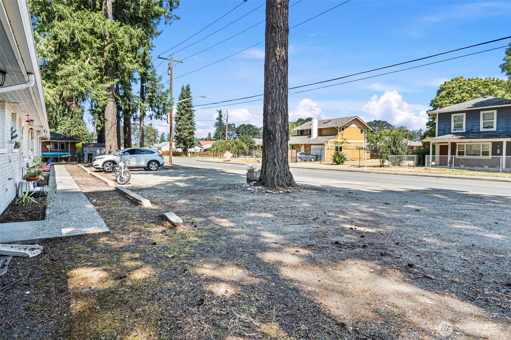 8502-8508 Berkeley Avenue Southwest Lakewood, WA 98498 - Photo 18 of 19 a view of a house with backyard porch and sitting area