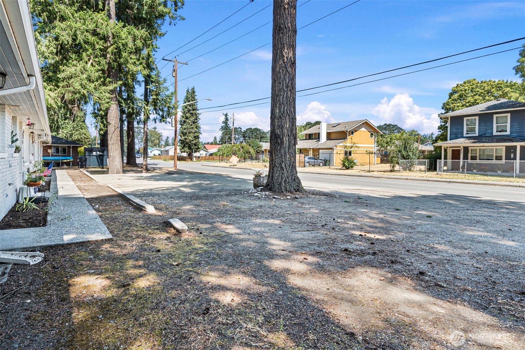 8502-8508 Berkeley Avenue Southwest Lakewood, WA 98498 - Photo 19 of 19 a view of a house with a yard
