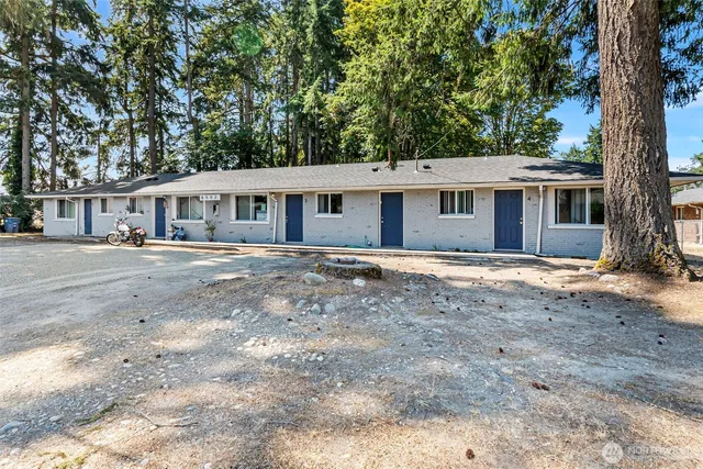front view of a house with a yard