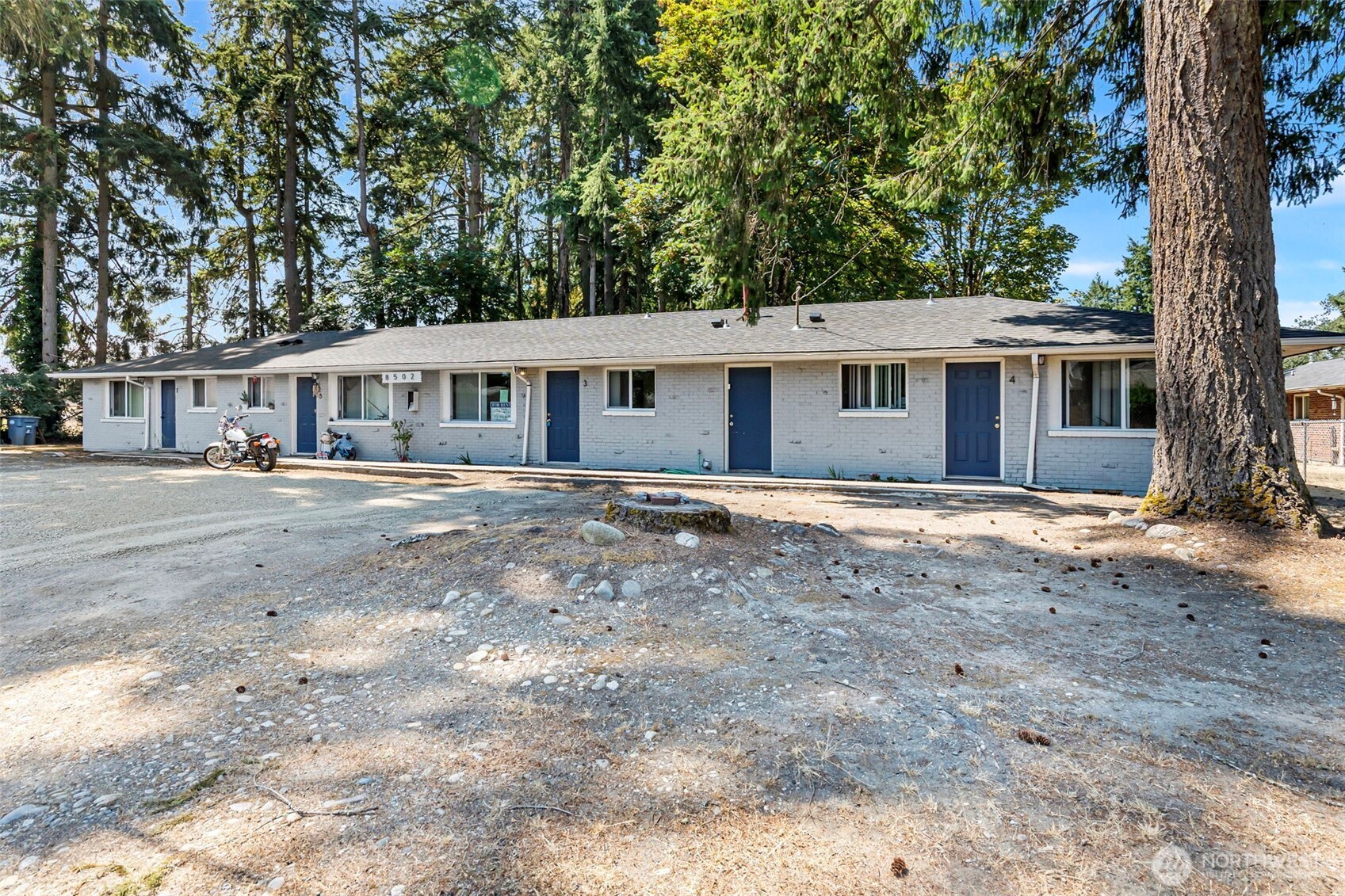 8502-8508 Berkeley Avenue Southwest Lakewood, WA 98498 - Photo 2 of 19 front view of a house with a yard