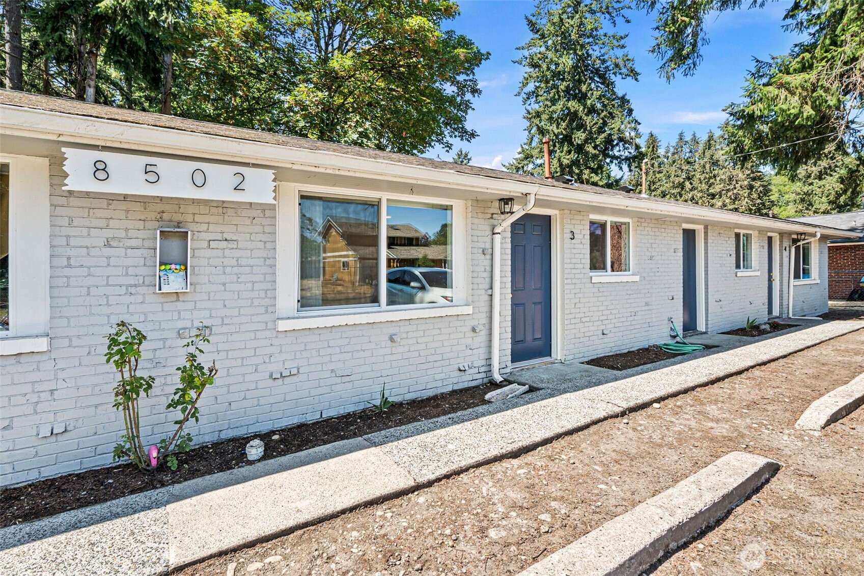 8502-8508 Berkeley Avenue Southwest Lakewood, WA 98498 - Photo 3 of 19 a front view of a house with a yard
