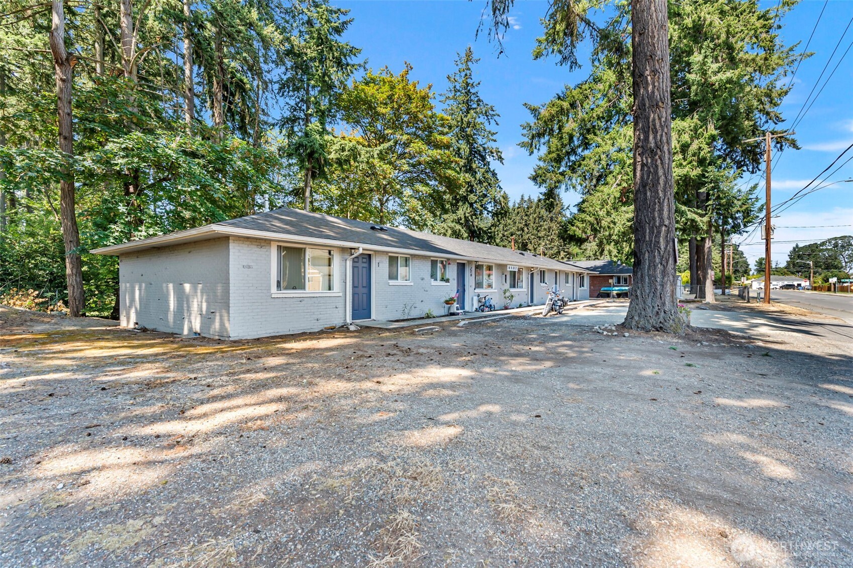 8502-8508 Berkeley Avenue Southwest Lakewood, WA 98498 - Photo 4 of 19 a view of a house with a yard and large tree