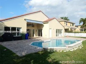 a view of outdoor space and swimming pool