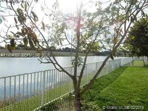 a balcony with trees in front of it