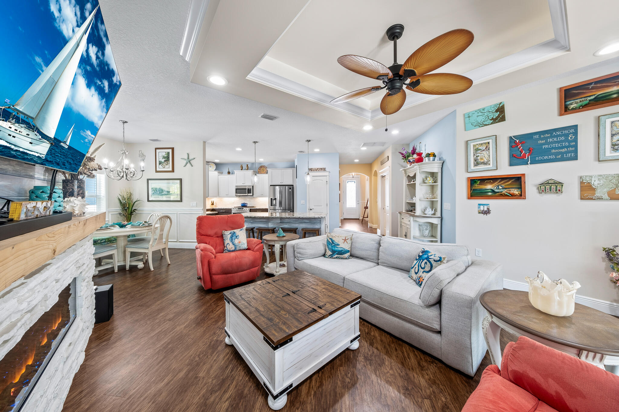 1718 Tullagee Avenue Melbourne, FL 32940 - Photo 11 of 35 a living room with furniture kitchen view and a chandelier