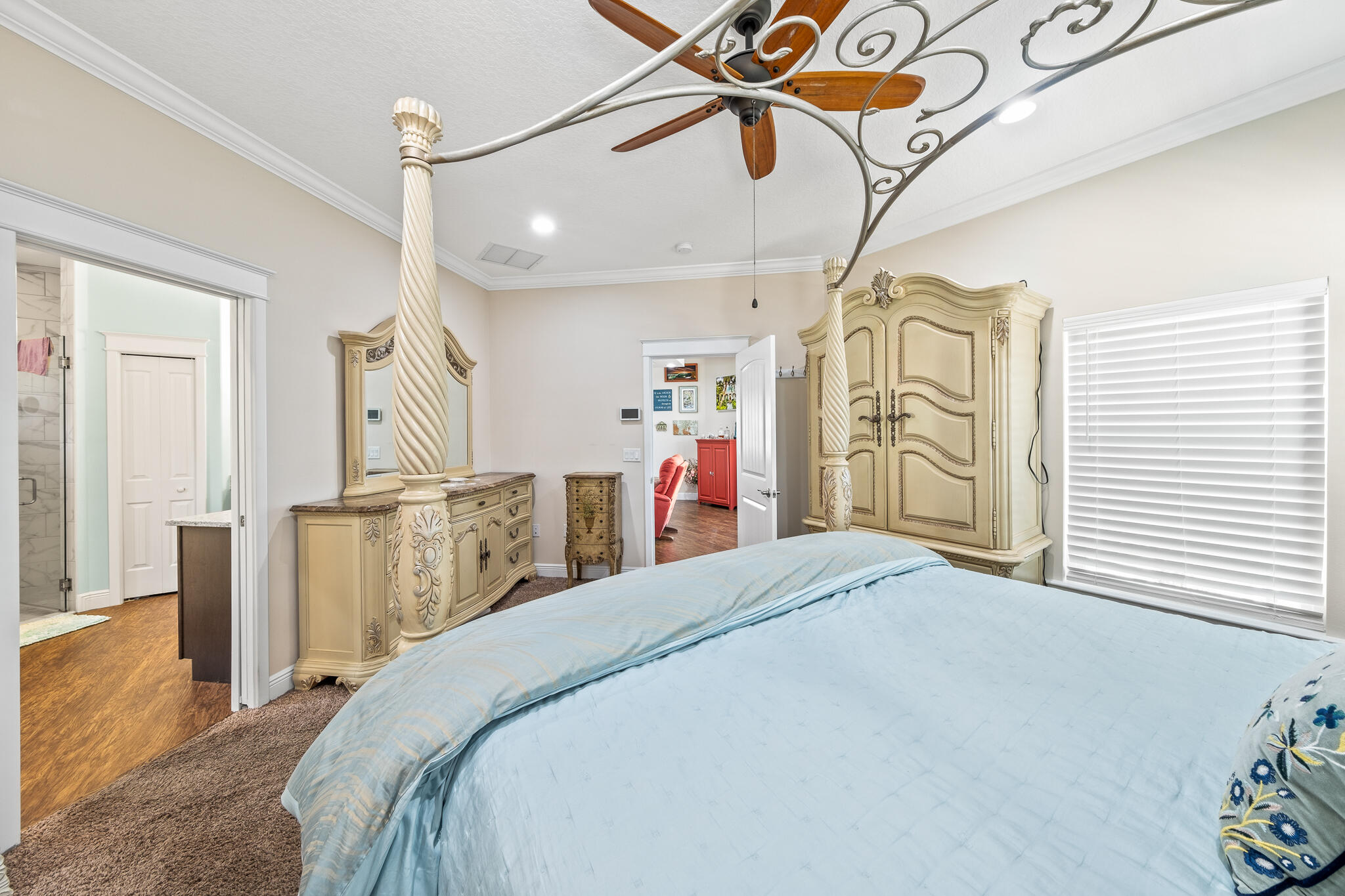 1718 Tullagee Avenue Melbourne, FL 32940 - Photo 13 of 35 a bed room with a bed and a chandelier