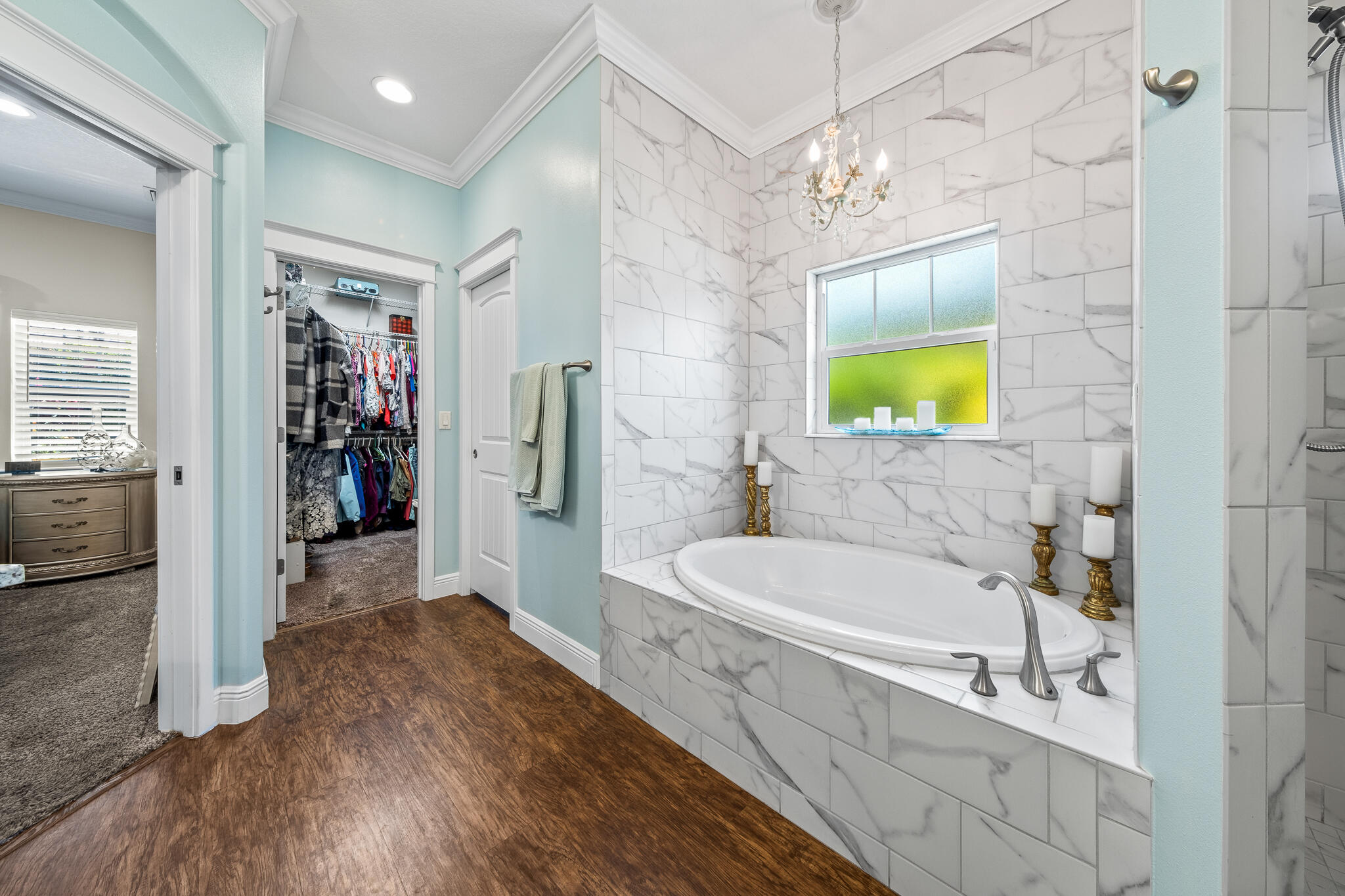 1718 Tullagee Avenue Melbourne, FL 32940 - Photo 16 of 35 a bathroom with a tub sink and a mirror