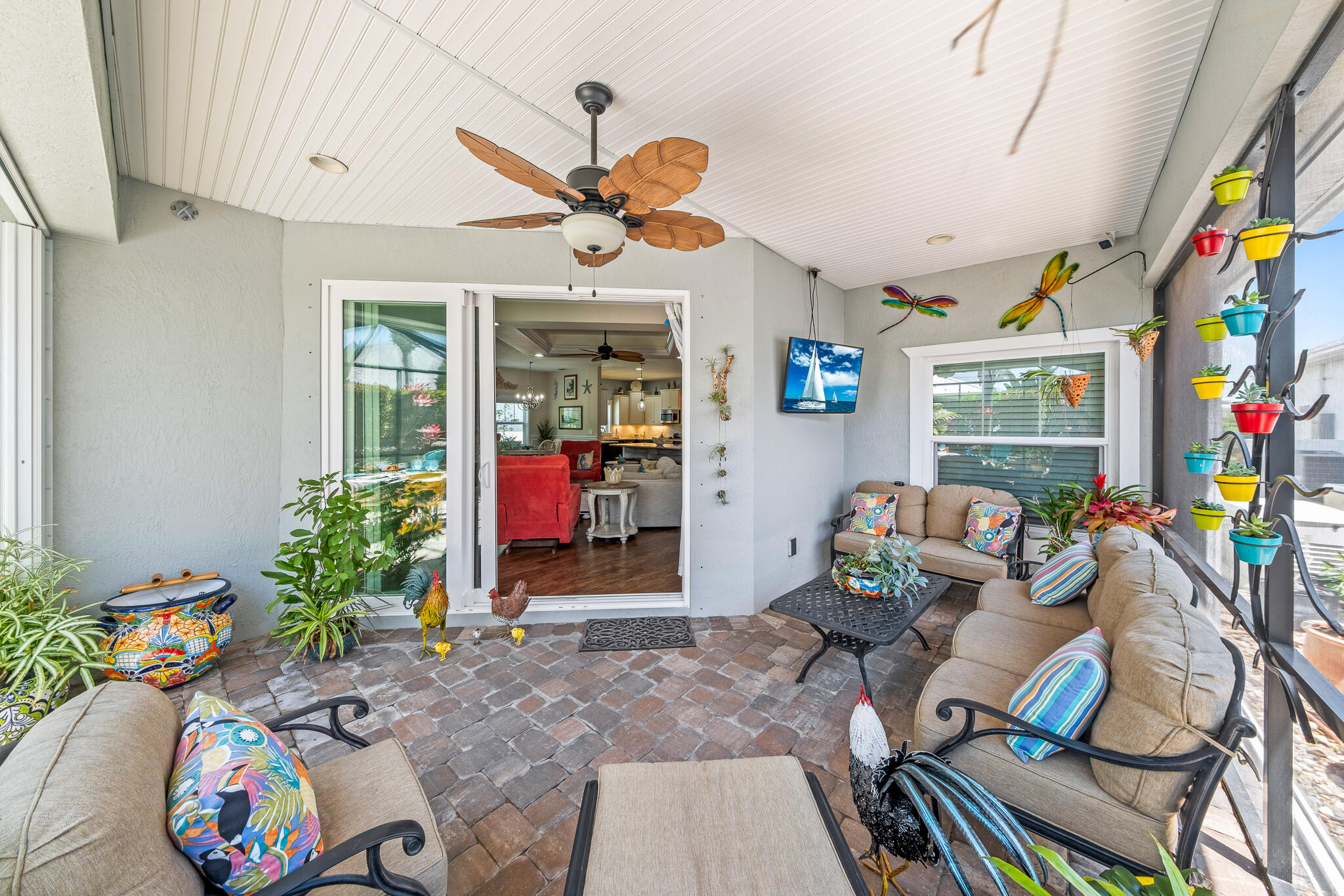 1718 Tullagee Avenue Melbourne, FL 32940 - Photo 23 of 35 a living room with furniture and a flat screen tv