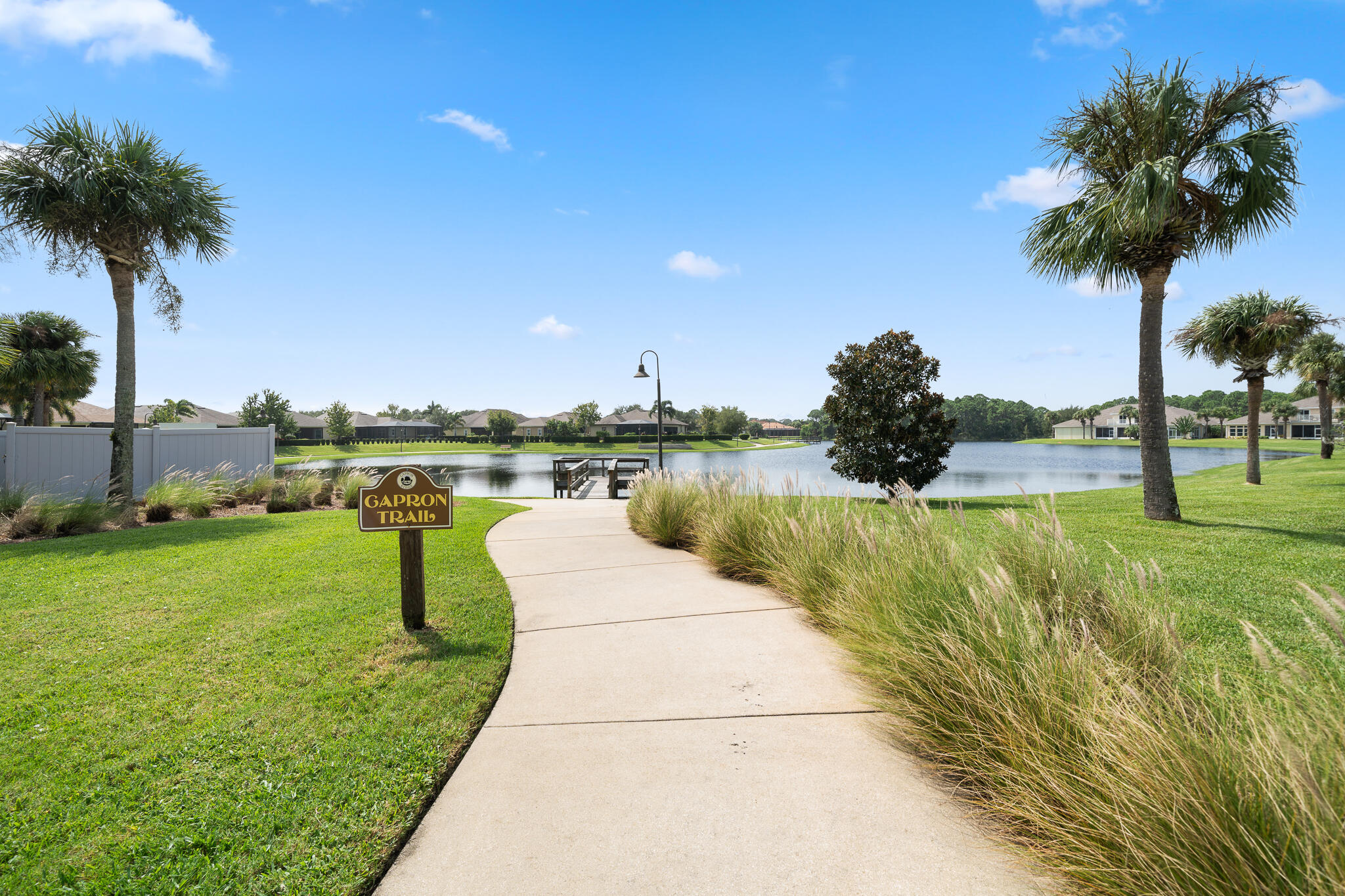 1718 Tullagee Avenue Melbourne, FL 32940 - Photo 30 of 35 a view of a lake with a yard