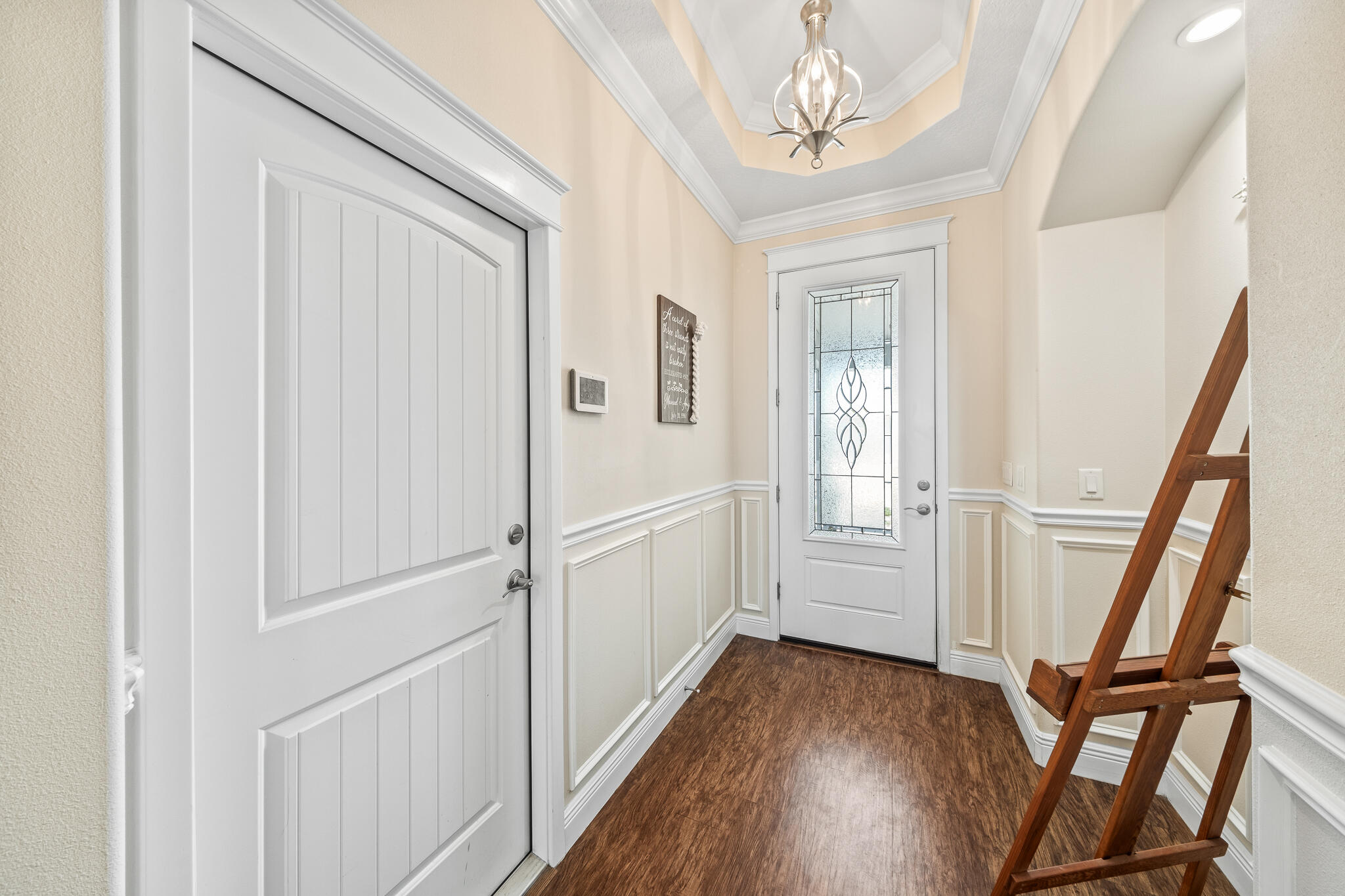 1718 Tullagee Avenue Melbourne, FL 32940 - Photo 4 of 35 a view of a hallway with wooden floor and staircase