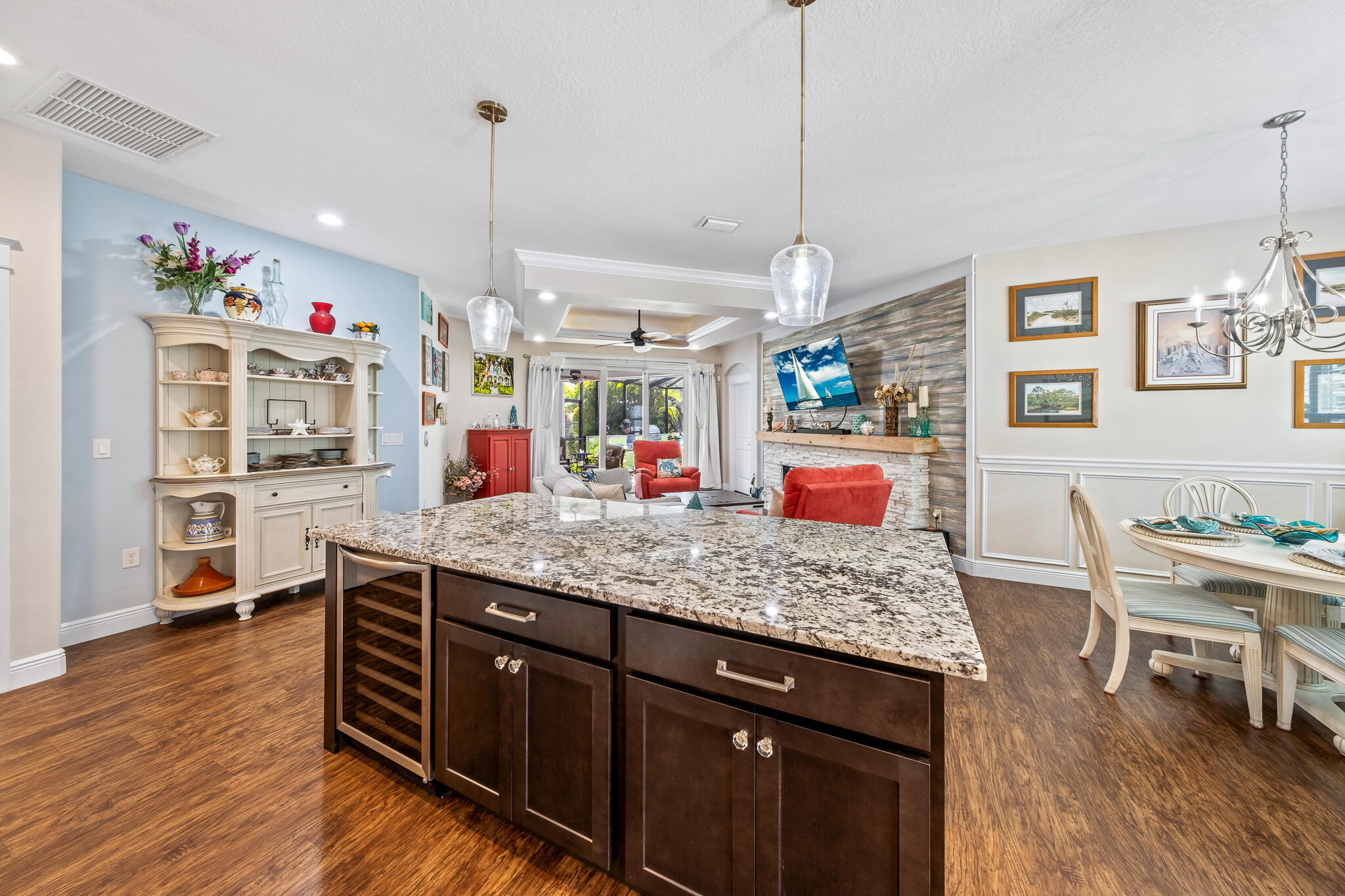 1718 Tullagee Avenue Melbourne, FL 32940 - Photo 8 of 35 a kitchen with stainless steel appliances granite countertop a sink dishwasher and a wooden floor