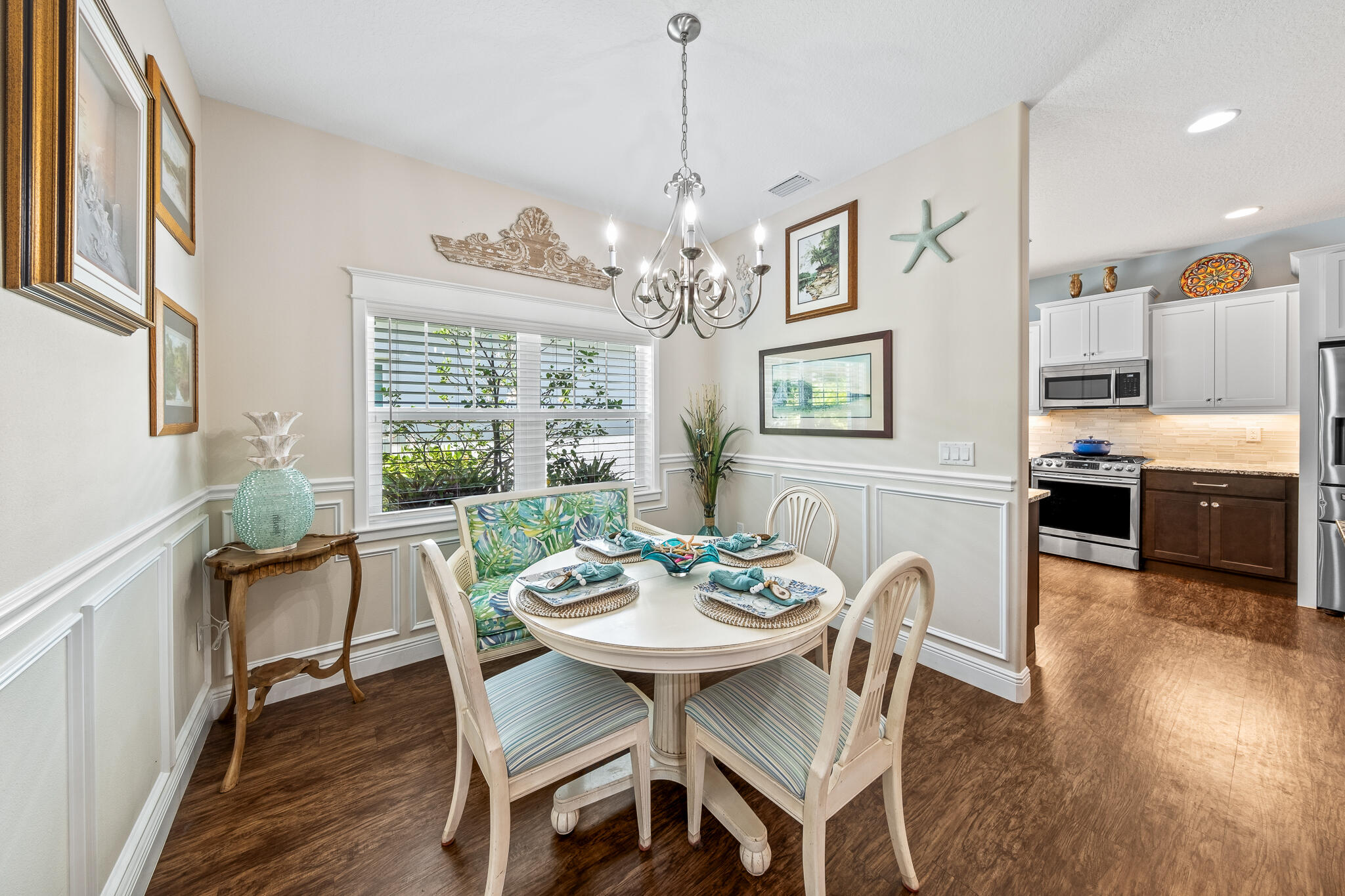 1718 Tullagee Avenue Melbourne, FL 32940 - Photo 9 of 35 a view of a dining room with furniture window and wooden floor