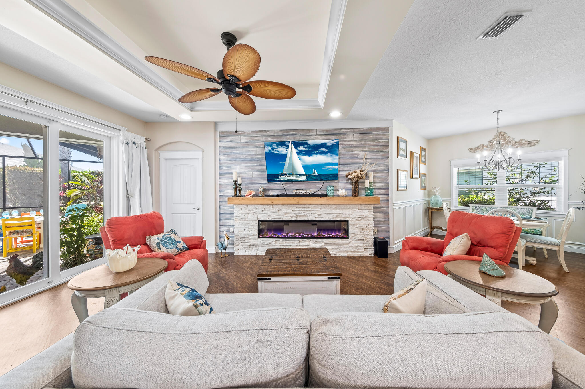 1718 Tullagee Avenue Melbourne, FL 32940 - Photo 10 of 35 a living room with furniture fireplace and a large window