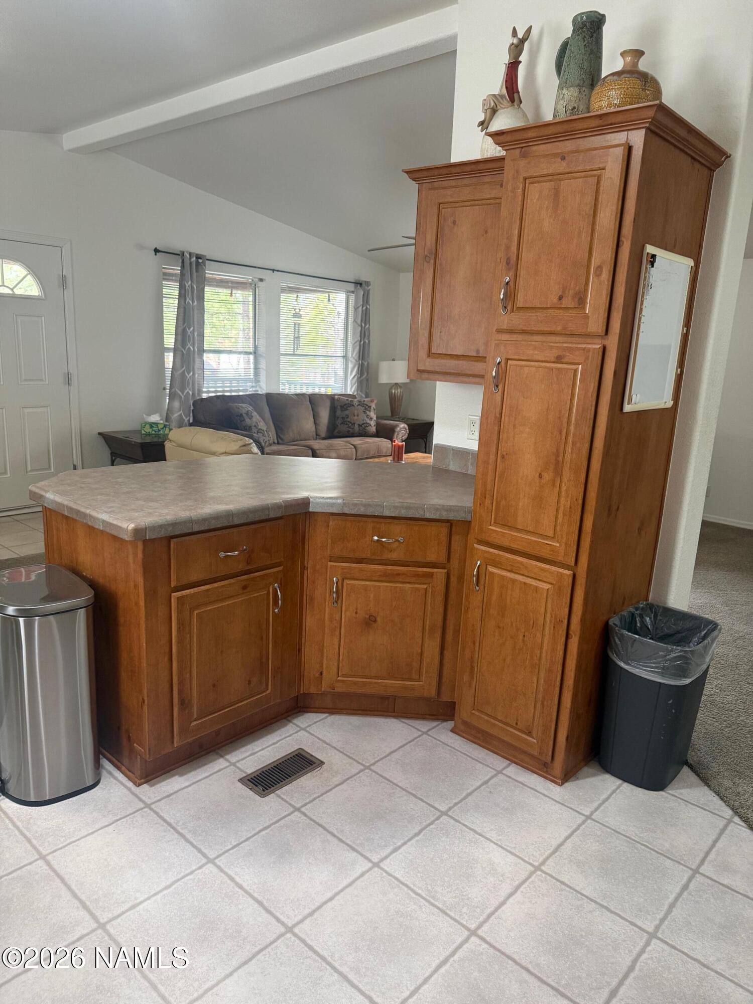 17075 Grizzly Ridge Munds Park, AZ 86017 - Photo 13 of 31 a kitchen with a sink a refrigerator and cabinets
