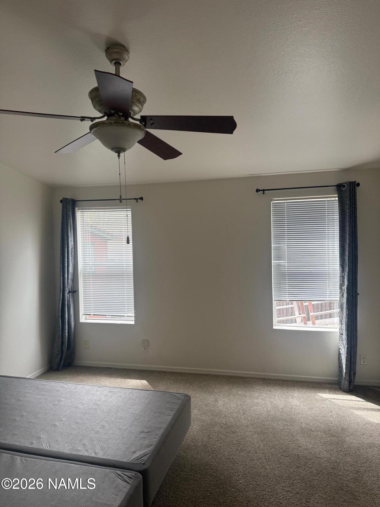 17075 Grizzly Ridge Munds Park, AZ 86017 - Photo 17 of 31 a view of an empty room with a window
