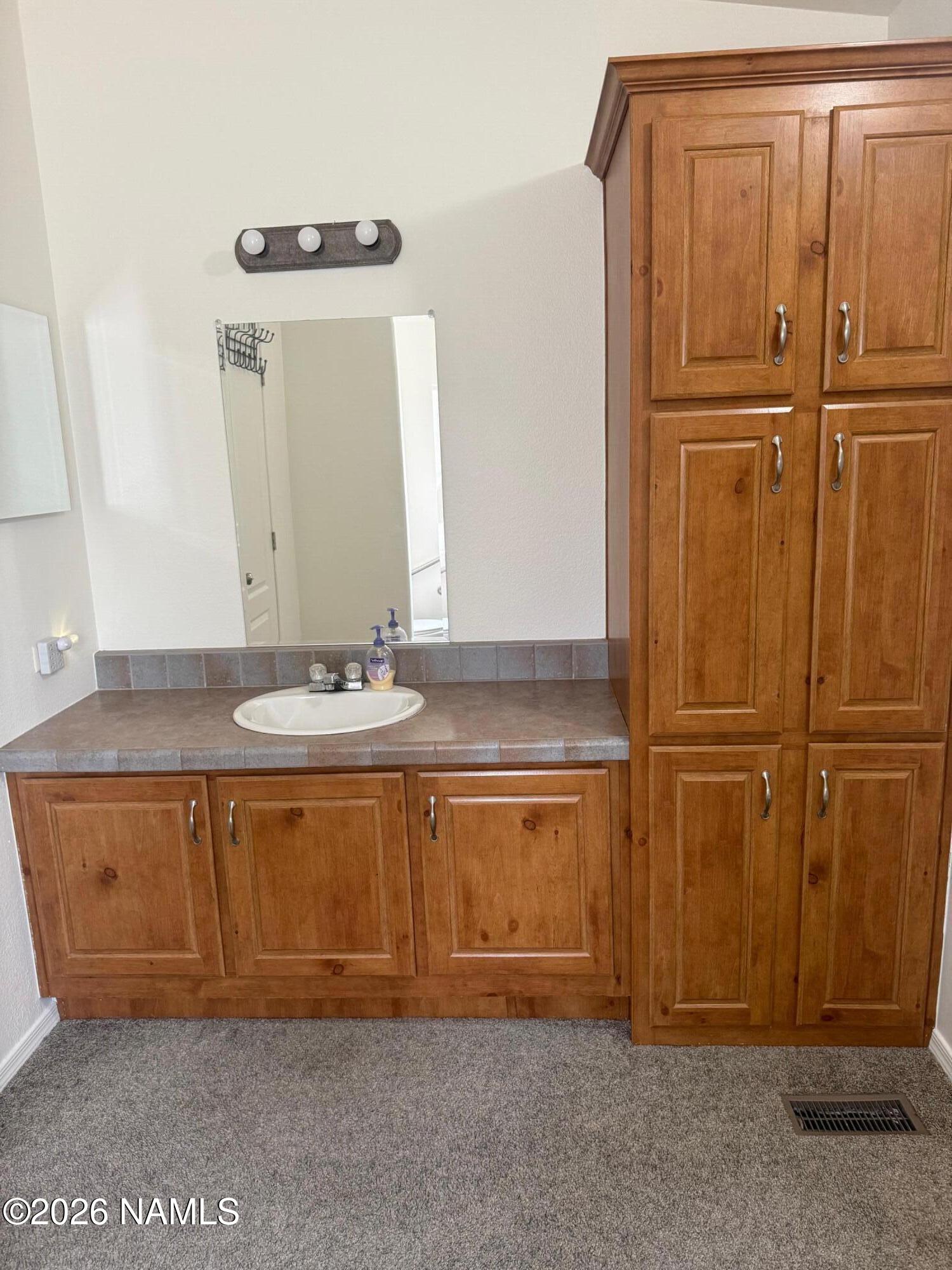 17075 Grizzly Ridge Munds Park, AZ 86017 - Photo 21 of 31 a bathroom with a tub and a sink