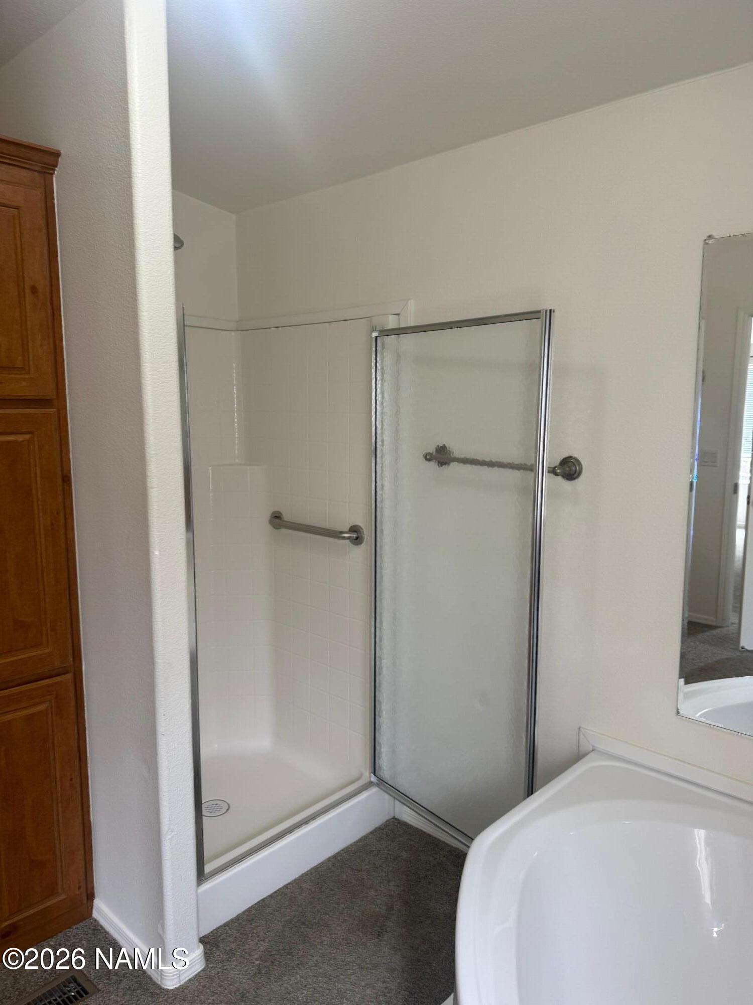 17075 Grizzly Ridge Munds Park, AZ 86017 - Photo 22 of 31 a bathroom with a shower and toilet
