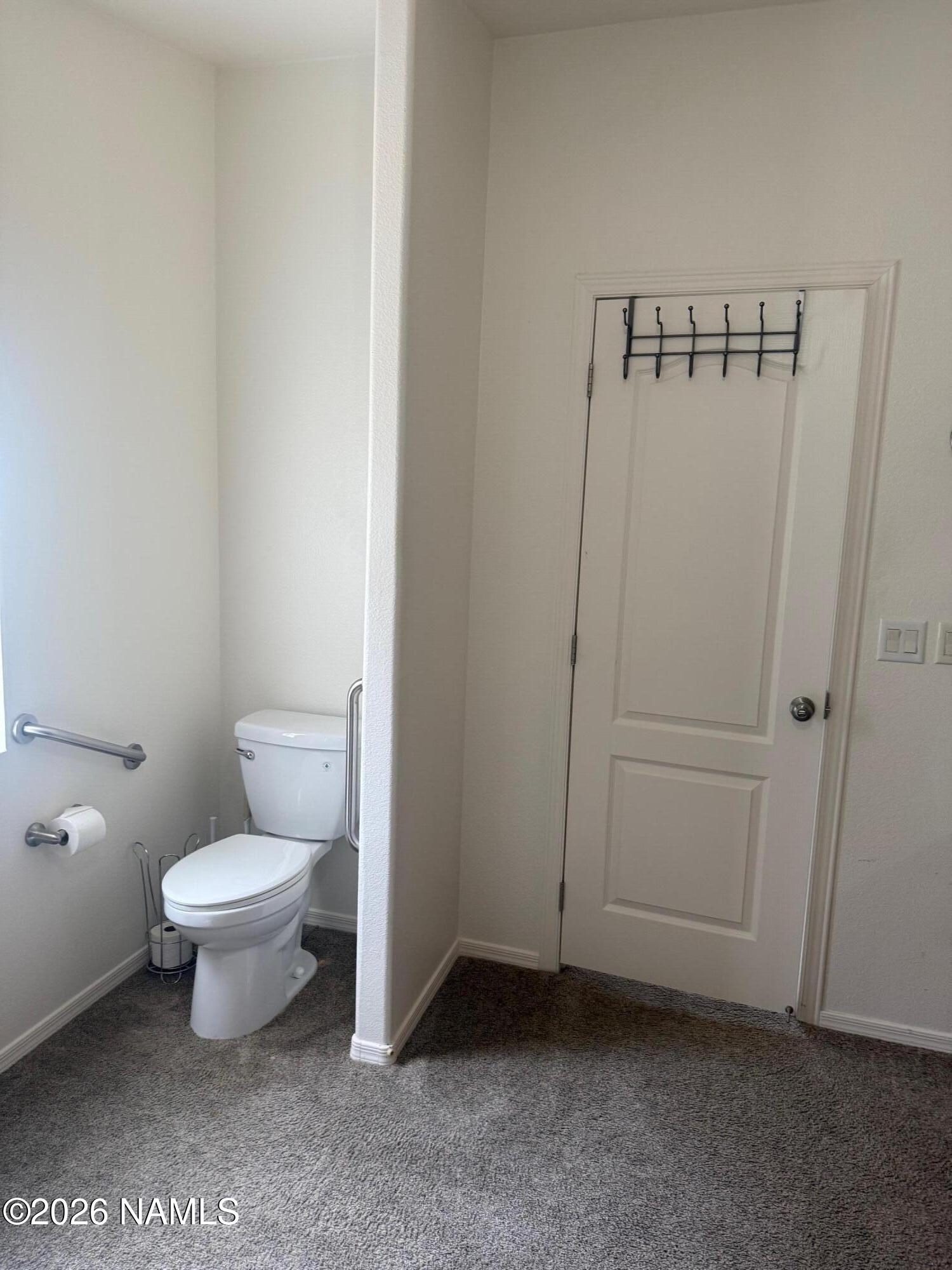 17075 Grizzly Ridge Munds Park, AZ 86017 - Photo 23 of 31 a bathroom with a toilet