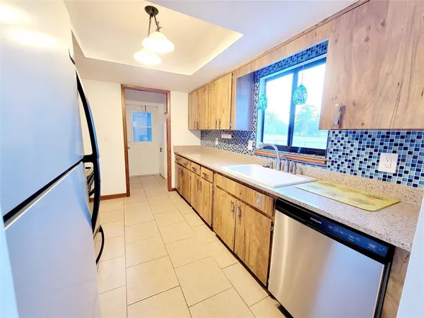 a kitchen with a sink and a stove