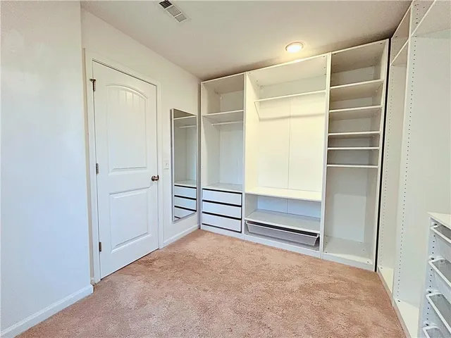 a view of an empty walk in closet