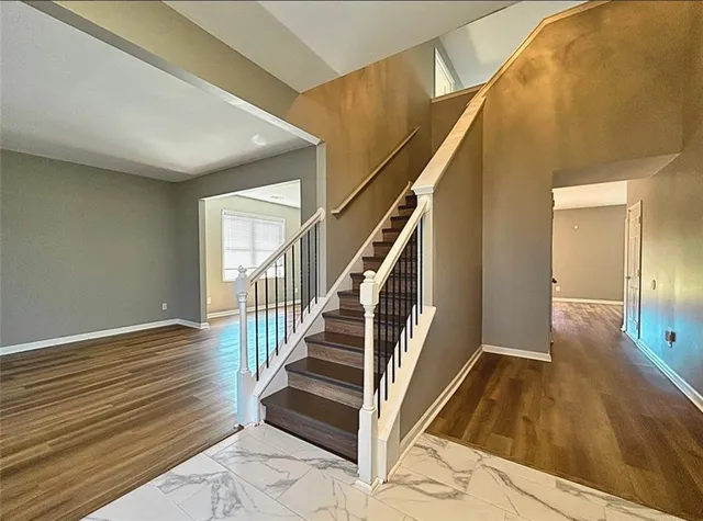 a view of staircase with wooden floor and staircase