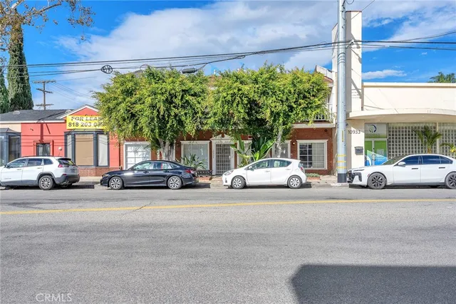 a view of a cars parked in front of a building