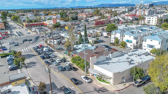 an aerial view of residential building with parking