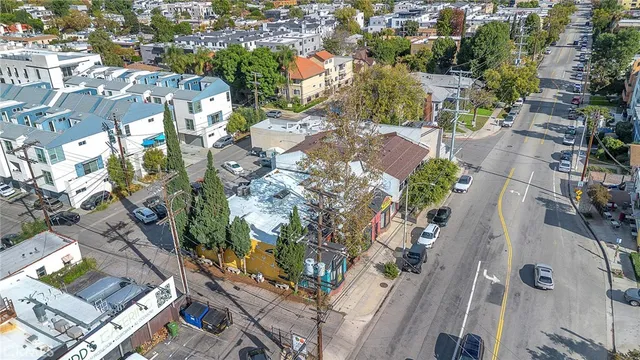 an aerial view of residential houses with outdoor space