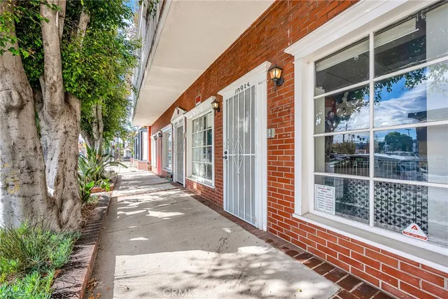 a view of a entrance door of the house with a yard