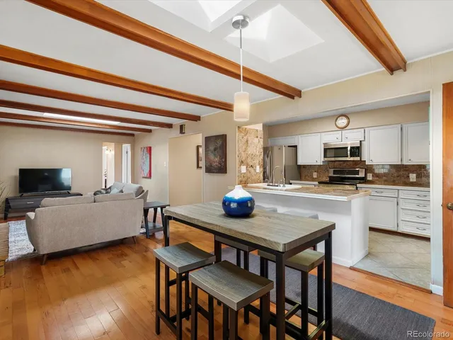 a kitchen with a table and chairs in it