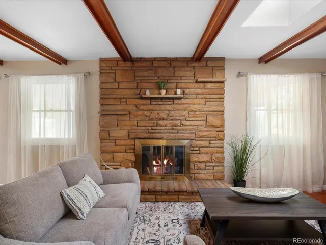 a living room with furniture and a table