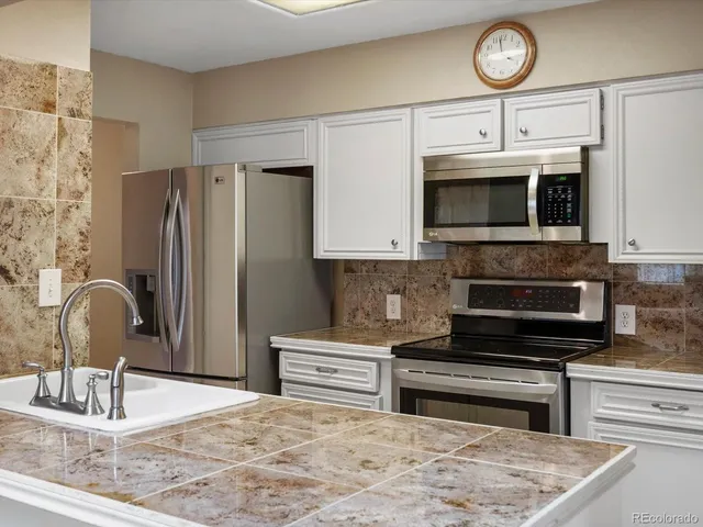 a kitchen with a stove and a microwave