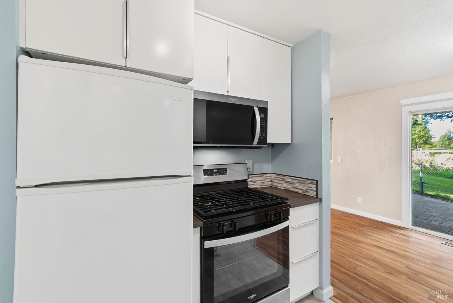 790 Hudis Street Rohnert Park, CA 94928 - Photo 21 of 41 a kitchen with stainless steel appliances a refrigerator sink and microwave